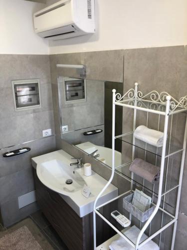 a bathroom with a sink and a mirror at Villa Trevisi - ROOMS in Treviso