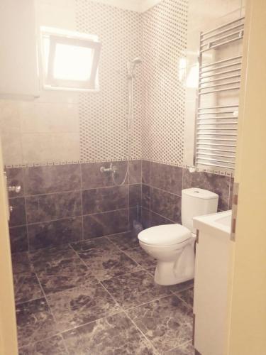 a bathroom with a toilet and a shower and a sink at Trabzon Meydan in Trabzon