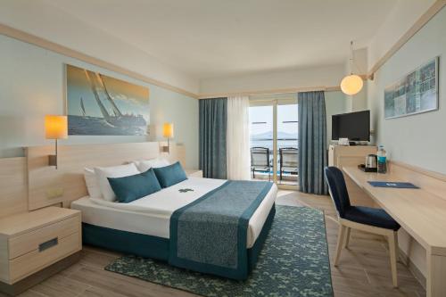 A bed or beds in a room at La Blanche Resort & Spa