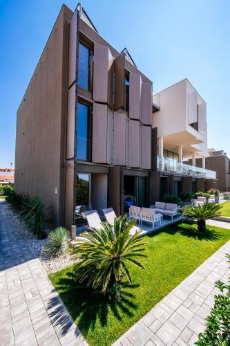 an image of a house with a yard at Dedaj Resort - Villa Auri in Zadar