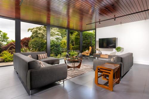 a living room with two couches and a tv at Sweden Lodge - wonderful property in Ambleside in Ambleside
