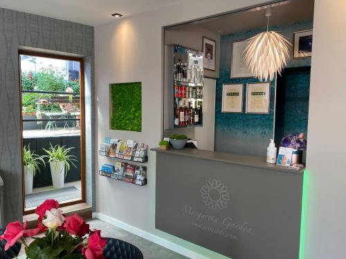 a shop with a counter and a window at Margaréta Garden & SPA in Eger