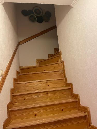 a set of wooden stairs in a house at Guest House Alea in Ulcinj