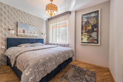 En eller flere senge i et værelse på Taikos hill apartament