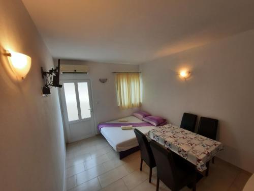 Katil atau katil-katil dalam bilik di Apartments Pitarević