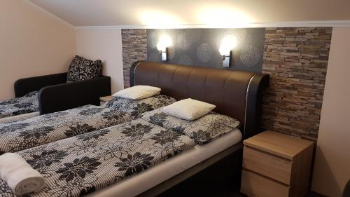 Posteľ alebo postele v izbe v ubytovaní Central-Aqua Apartman