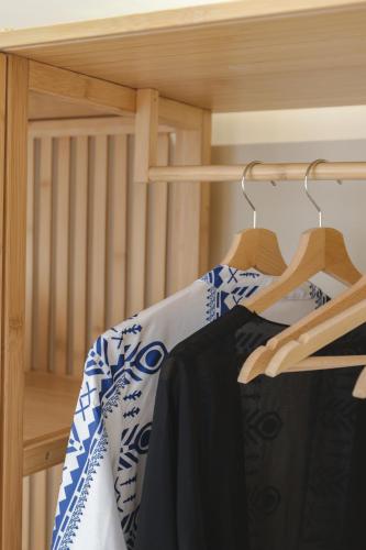 a bedroom with a bunk bed with blue and white towels at Liberte Maisonettes in Parga