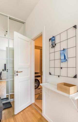 a room with a white door and a room with at Cozy Modern Studio - Great for Short Trips in Riga