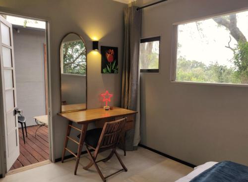 a small room with a table and a window at Karkloof Hideout in Howick