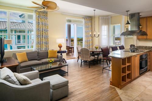 a living room with a couch and a table at Wild Dunes Resort - Residences at Sweetgrass in Isle of Palms