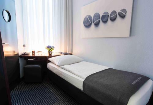Krevet ili kreveti u jedinici u objektu Hotel Concorde