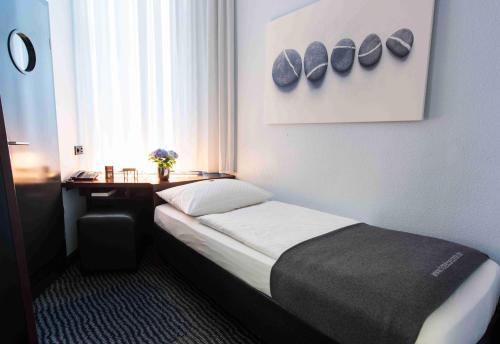 Postel nebo postele na pokoji v ubytování Hotel Concorde