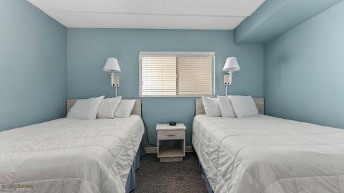 Tempat tidur dalam kamar di Beau Rivage Beach Resort
