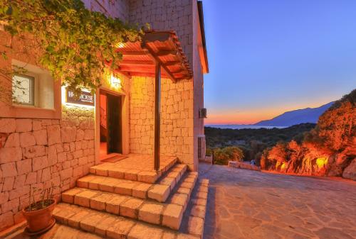 a brick building with stairs leading to a doorway at Hill House Adult Only in Kas