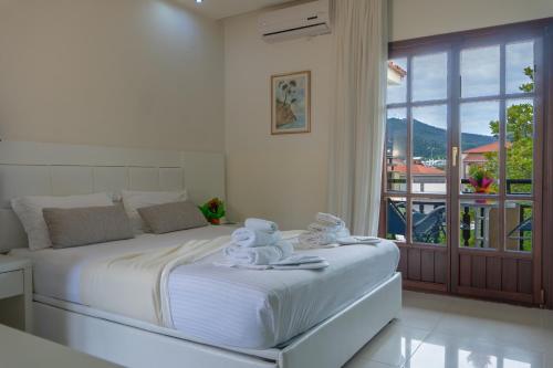 Un pat sau paturi într-o cameră la Macedon