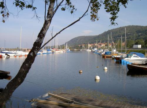 a bunch of boats docked in a harbor at Huskvarna Hotell & Vandrarhem in Huskvarna
