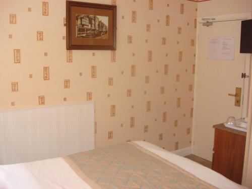 Ένα ή περισσότερα κρεβάτια σε δωμάτιο στο Yellow Mountain Hotel