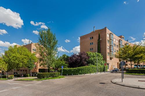 an empty street in front of a building at Las Huertas - Modern Accommodation in Madrid Conde Orgaz in Madrid