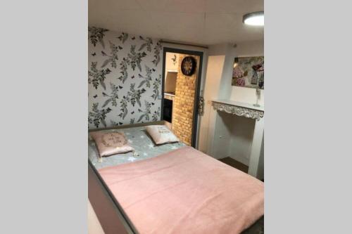 Ένα ή περισσότερα κρεβάτια σε δωμάτιο στο Appartement cocooning familial