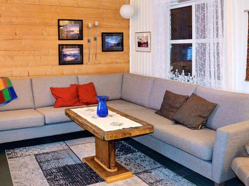 a living room with a couch and a table at 6 person holiday home in Olderdalen in Olderdalen