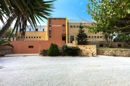 a building with a lot of gravel in front of it at Pachia Ammos Falasarna in Falasarna