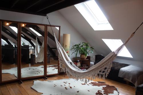 a hammock in the middle of a room at PAKHUIS in Ghent