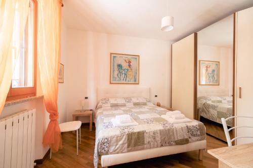 Postel nebo postele na pokoji v ubytování Les Chambres