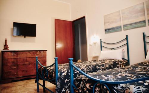 Posteľ alebo postele v izbe v ubytovaní CASA PAOLINA NEL CENTRO DI BRACCIANO