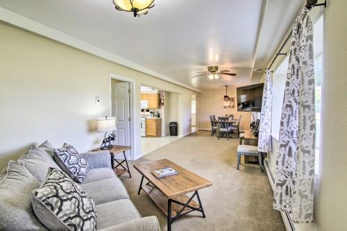 a living room with a couch and a table at Montanas Emigrant Peaks Getaway Apt with Mtn Views in Emigrant