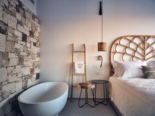 Cama o camas de una habitación en Etheria Luxury Villas & Suites