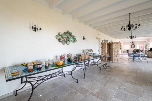 a large room with a table with food on it at STELLA MARE in Algajola