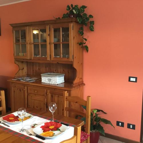 a dining room with a table with a plate of food at Home Iseo Lake in Bossico