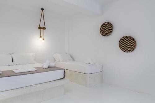 Ένα ή περισσότερα κρεβάτια σε δωμάτιο στο Amethyst Luxury Suites Oia