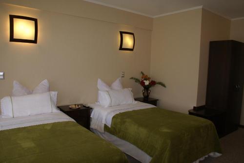 Ένα ή περισσότερα κρεβάτια σε δωμάτιο στο Villa Baviera, Hotel Baviera Chile