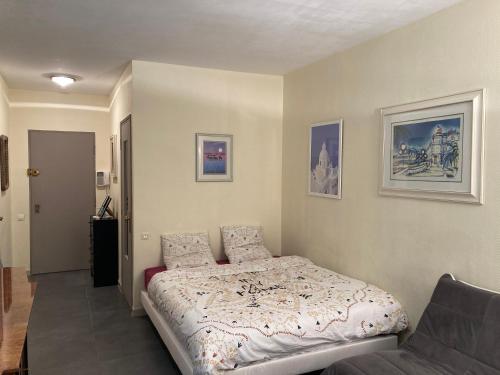 En eller flere senge i et værelse på Meublés de Tourisme Beaulieu