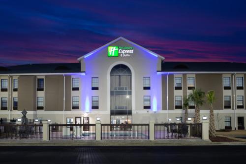 a hotel with a lit up building at night at Holiday Inn Express & Suites - Morehead City by IHG in Morehead City