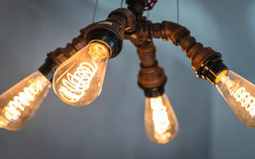 a group of lights hanging from a chandelier at Apartament SPOKOLOKO Wiślańska Złoty B1 in Szczyrk