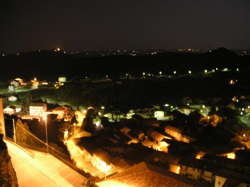 a view of a city at night with lights at Il Borgo B&B in Castellinaldo