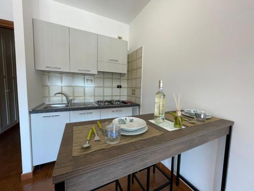a kitchen with a wooden counter top in a room at Suite Semeria 133 - Box Auto e terrazzo in Sanremo