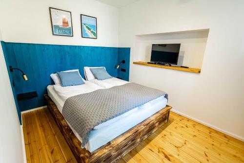 Postel nebo postele na pokoji v ubytování Trzy Rybki - Belona dom z basenem i jacuzzi