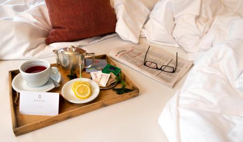 Postel nebo postele na pokoji v ubytování Charme Hotel Uridl