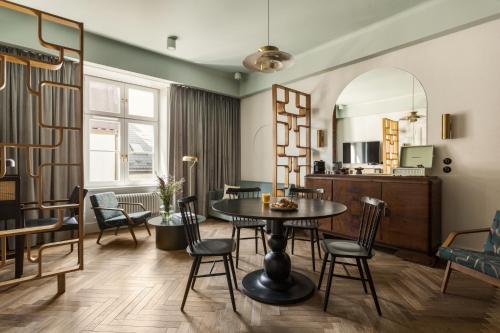 a dining room with a table and chairs at Angelus Apartments in Kraków