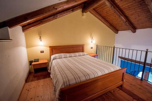 Postel nebo postele na pokoji v ubytování Ristorante Albergo Da Maurizio