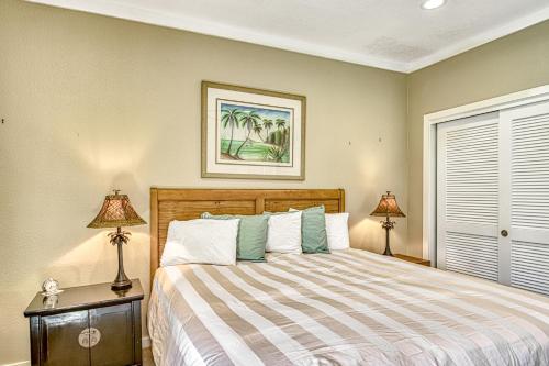 a bedroom with a bed and two lamps and a window at Kapalua Golf Villas 16V3 in Kahana
