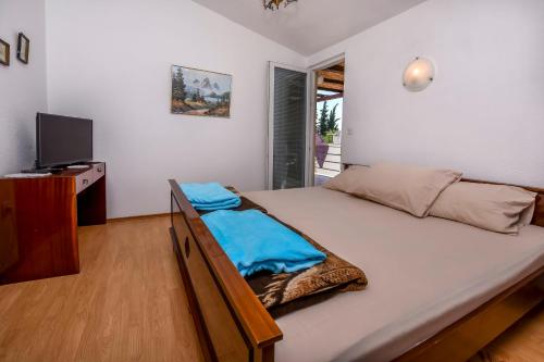 Postel nebo postele na pokoji v ubytování Apartments Jelka