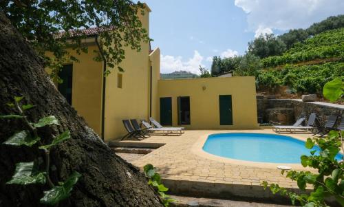 a villa with a swimming pool in front of a house at Casa de São Roque - Lamego in Cambres