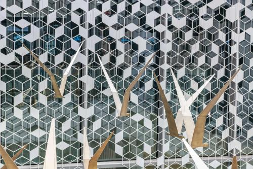 a wall with a pattern of white and black tiles at Park Inn by Radisson, Riyadh in Riyadh