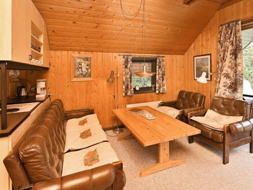 a living room with a couch and a table at 6 person holiday home in N rre Nebel in Nørre Nebel