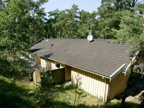 a house with a pitched roof with a satellite at 8 person holiday home in Nex in Vester Sømarken