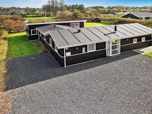 an overhead view of a house with a roof at 6 person holiday home in Hj rring in Hjørring